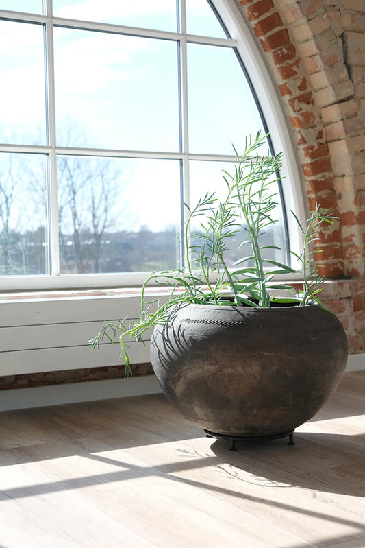 Clay planter pot on foot